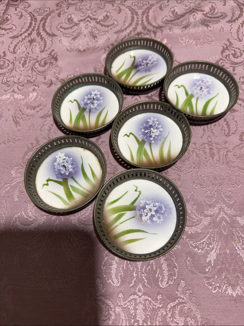 six antique German porcelain coasters featuring a botanical hyacinth